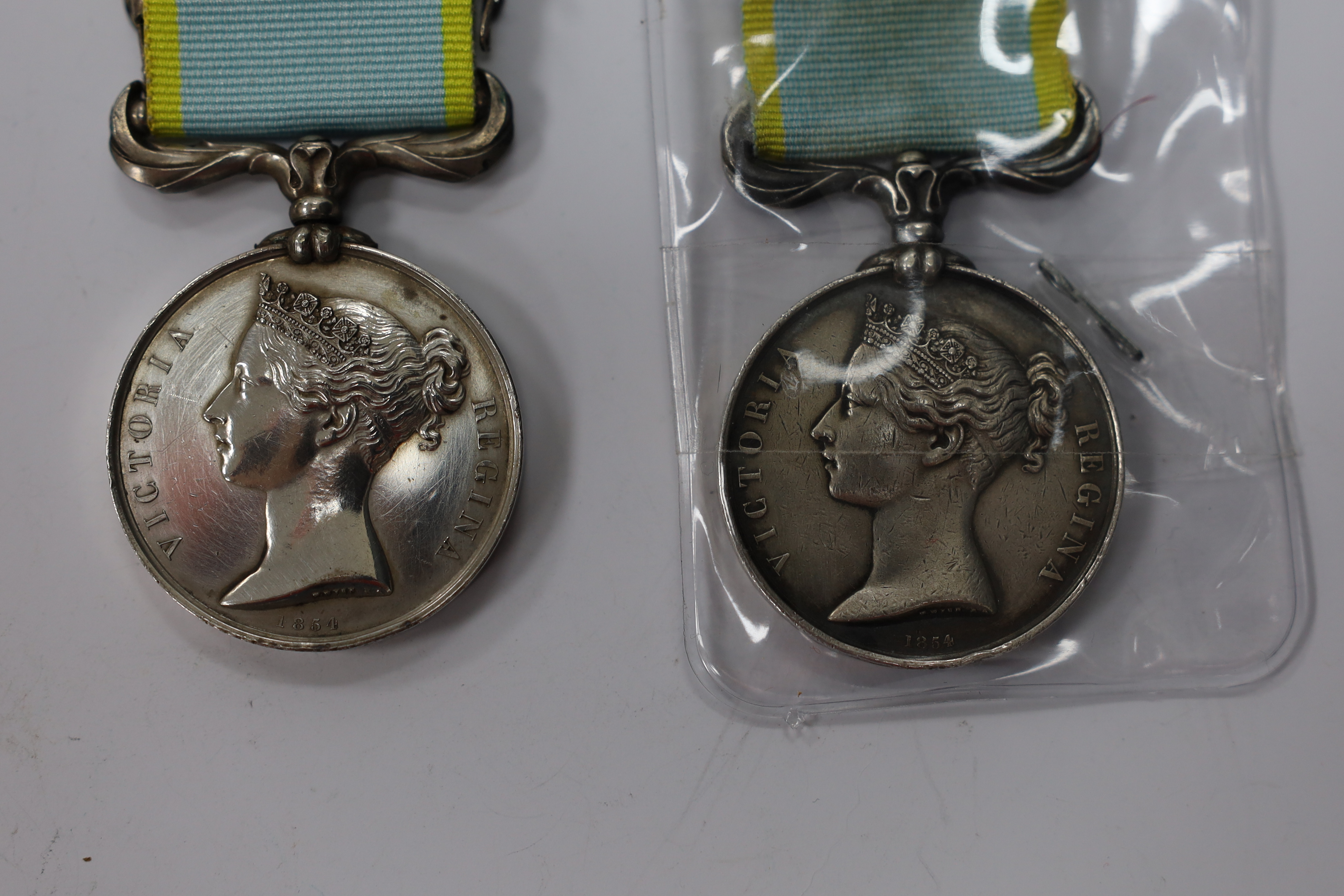 Two Crimea medals; one with Sebastopol clasp, the other Inkermann, both unnamed as issued